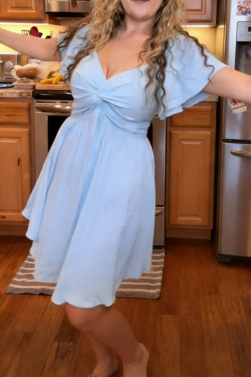 Women's summer short-sleeved high-waisted dress with a sweetheart neckline and a bow at the back a resort dress